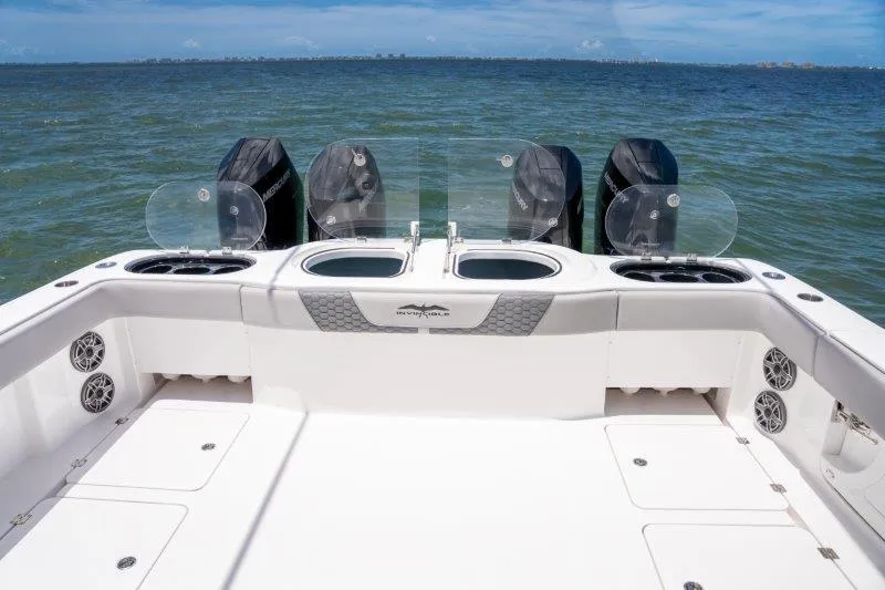  Yacht Photos Pics 2025 Invincible 46 Catamaran with multiple outboard engines on open water.