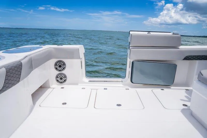  Yacht Photos Pics Invincible 46 Catamaran 2025 deck view with ocean backdrop and clear blue sky.