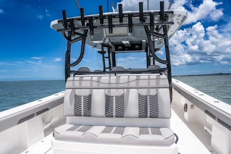  Yacht Photos Pics 2025 Invincible 46 Catamaran with sleek seating and rod holders on open water.