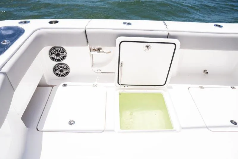  Yacht Photos Pics 2025 Invincible 46 Catamaran deck with storage compartments and speakers.