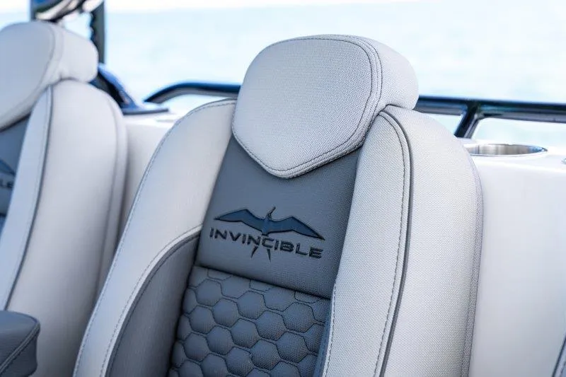  Yacht Photos Pics Luxury seating on 2025 Invincible 46 Catamaran, featuring sleek design and branding.