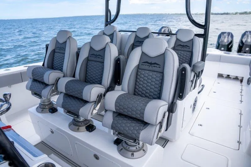  Yacht Photos Pics Luxury seating on 2025 Invincible 46 Catamaran, featuring ergonomic design and ocean backdrop.