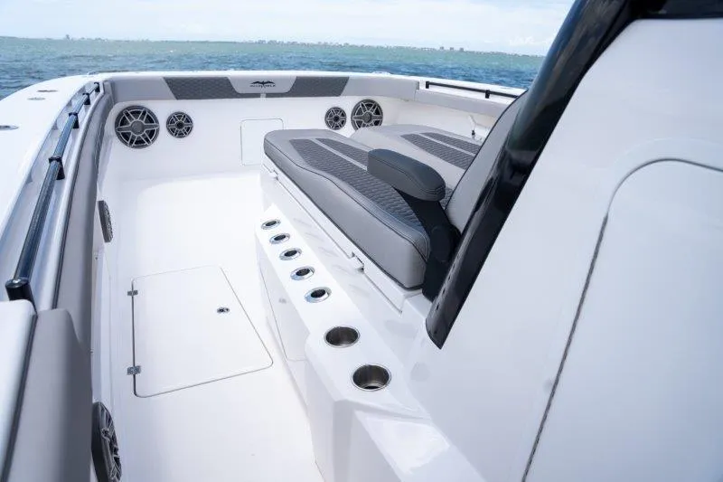  Yacht Photos Pics 2025 Invincible 46 Catamaran interior with seating and cup holders, overlooking the ocean.