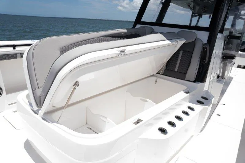  Yacht Photos Pics 2025 Invincible 46 Catamaran with open storage compartment on deck.