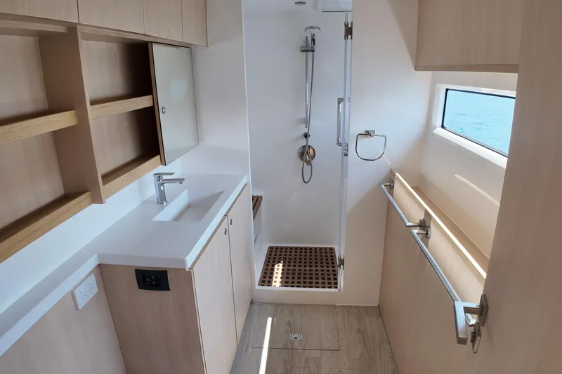  Yacht Photos Pics Modern bathroom interior on 2026 Longreach 58 yacht, featuring sleek design and ocean view.