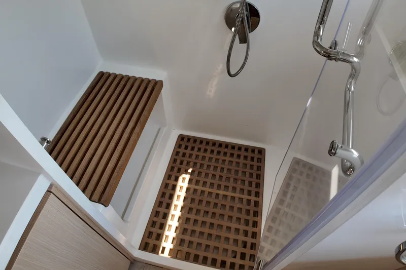 Yacht Photos Pics Modern shower with wooden floor and bench in 2026 Longreach 58 model.