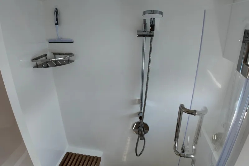  Yacht Photos Pics Modern shower in Longreach 58 yacht, featuring sleek fixtures and a wooden mat, 2026 model.