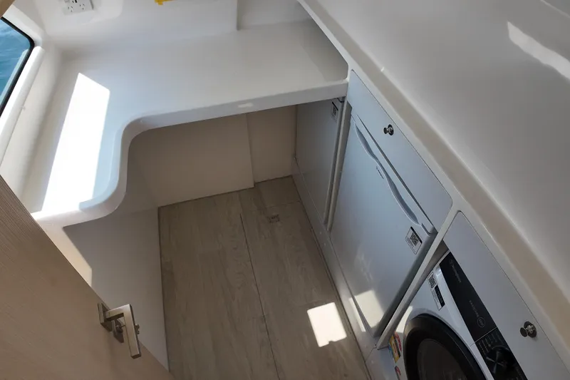  Yacht Photos Pics Laundry area in 2026 Longreach 58 yacht with washer and dryer.