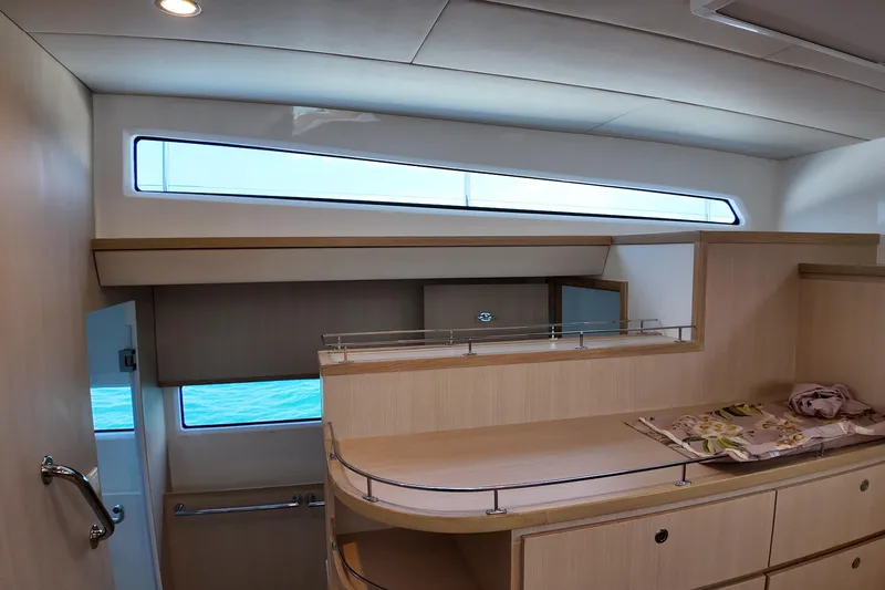  Yacht Photos Pics Interior of 2026 Longreach 58 yacht with modern wood finish and ocean view.