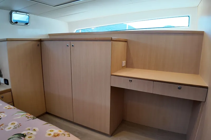  Yacht Photos Pics Interior of 2026 Longreach 58 yacht with wooden cabinetry and desk area.