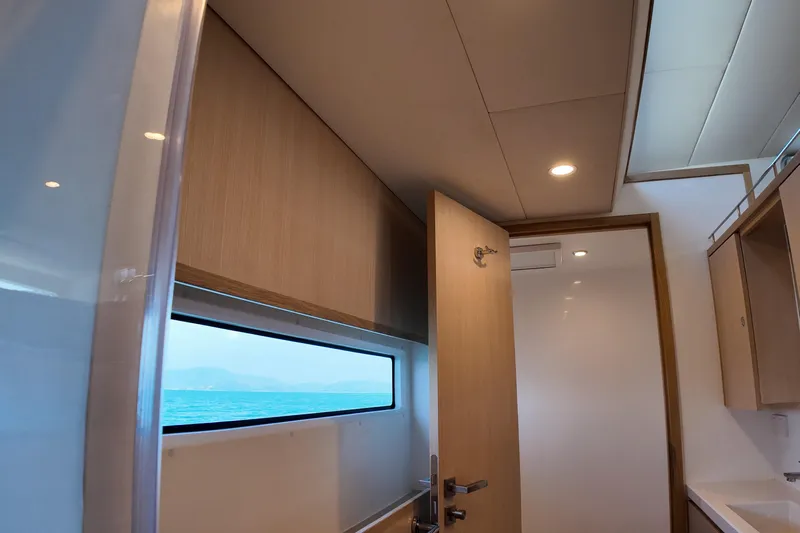  Yacht Photos Pics Interior of 2026 Longreach 58 yacht with modern design and ocean view window.