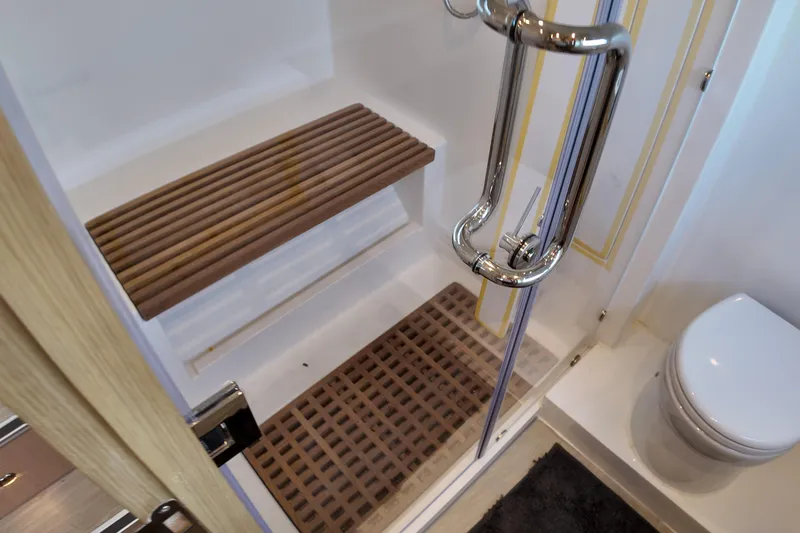  Yacht Photos Pics Luxurious Longreach 58 yacht bathroom with wooden accents and modern fixtures, 2026 model.