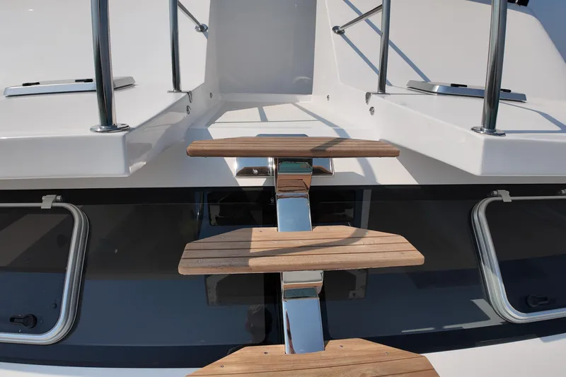  Yacht Photos Pics Staircase on 2026 Longreach 58 yacht with sleek design and wooden steps.