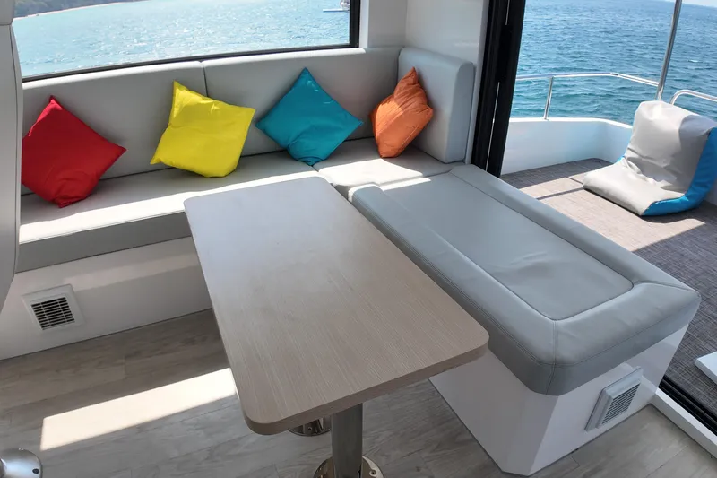  Yacht Photos Pics Luxurious Longreach 58 yacht interior with colorful cushions, ocean view, and modern seating, 2026 model.