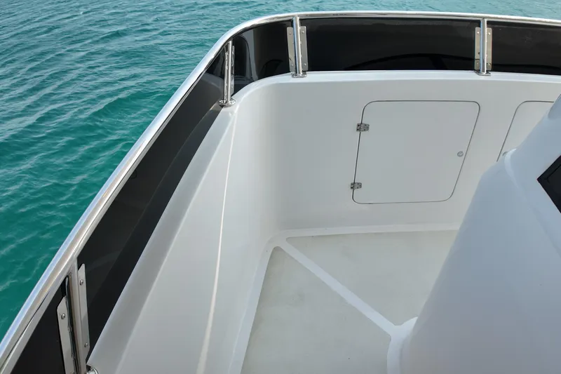  Yacht Photos Pics Deck view of 2026 Longreach 58 boat with sleek railing and ocean backdrop.