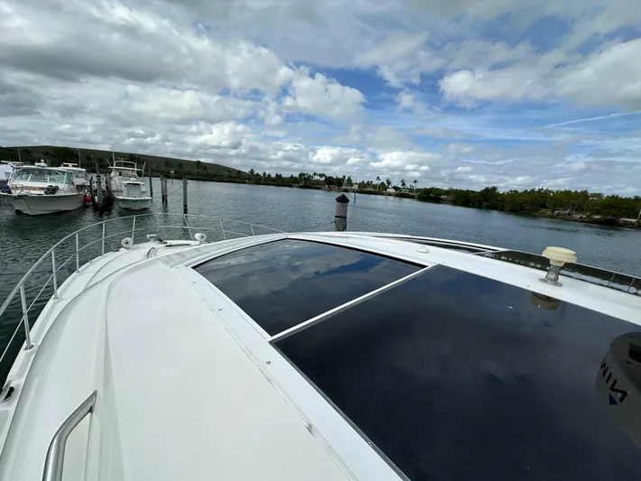  Yacht Photos Pics 2010 Sea Ray 470 Sundancer yacht docked in a scenic marina.