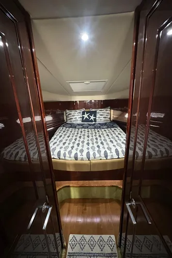  Yacht Photos Pics Luxurious cabin interior of 2010 Sea Ray 470 Sundancer yacht with elegant bedding.