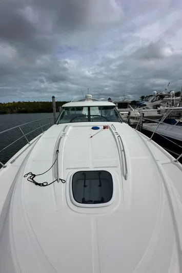  Yacht Photos Pics 2010 Sea Ray 470 Sundancer yacht docked under cloudy skies.