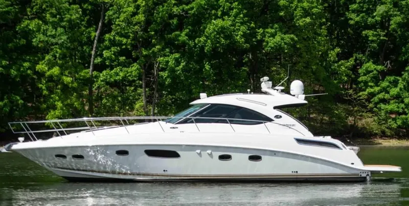  Yacht Photos Pics 2010 Sea Ray 470 Sundancer yacht cruising on a serene lake.
