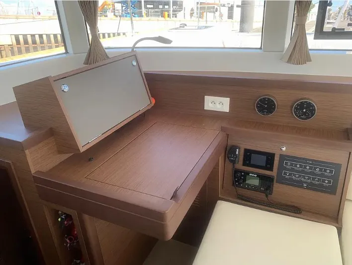  Yacht Photos Pics 2019 Lagoon 40 yacht interior with navigation station and control panel.
