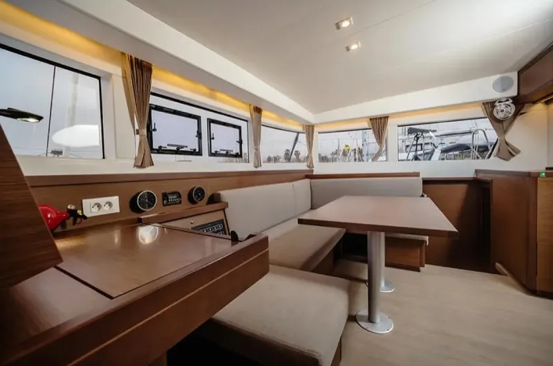 Yacht Photos Pics Interior of 2019 Lagoon 40 catamaran with modern seating and large windows.