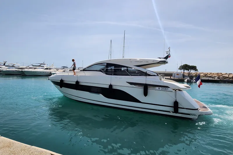  Yacht Photos Pics 2020 Fairline Targa 45 Open yacht cruising in a sunny marina.