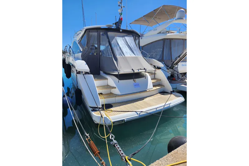  Yacht Photos Pics 2020 Fairline Targa 45 Open yacht docked in marina, rear view.