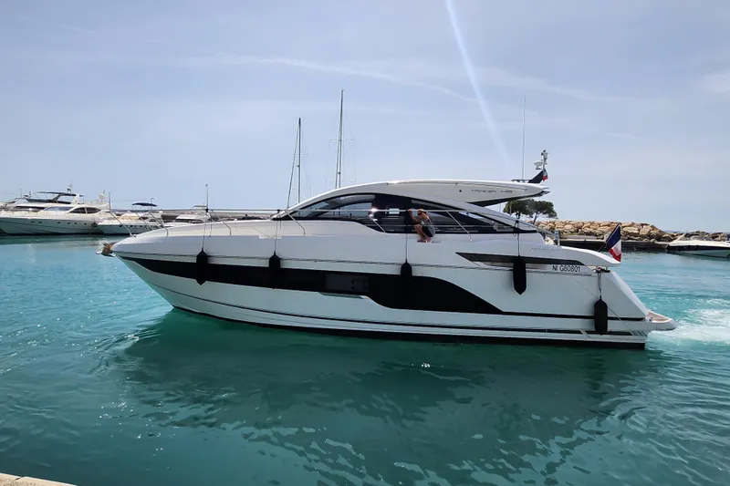  Yacht Photos Pics 2020 Fairline Targa 45 Open yacht cruising in a sunny marina.