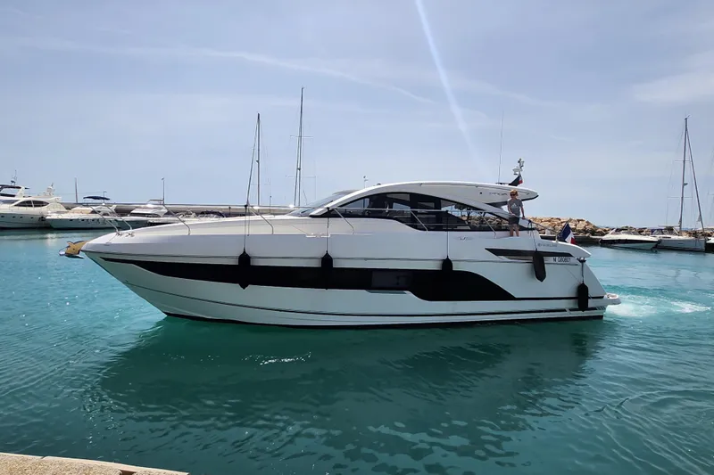  Yacht Photos Pics 2020 Fairline Targa 45 Open yacht in marina, sleek design, calm blue water.