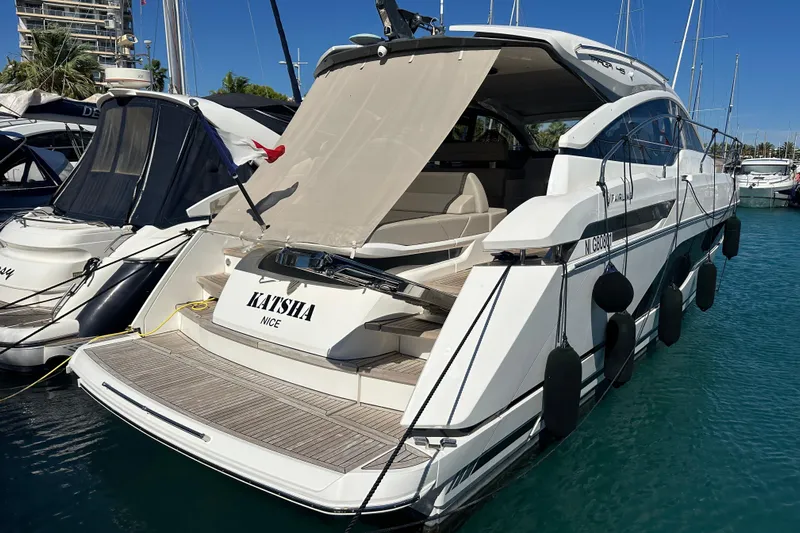  Yacht Photos Pics 2020 Fairline Targa 45 Open yacht docked in marina, rear view.