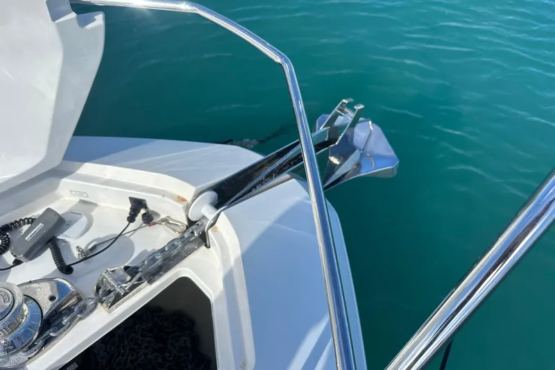  Yacht Photos Pics Fairline Targa 45 Open 2020 yacht anchor and chain mechanism in turquoise water.