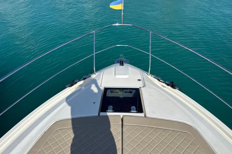  Yacht Photos Pics Bow view of 2020 Fairline Targa 45 Open yacht on clear blue water.
