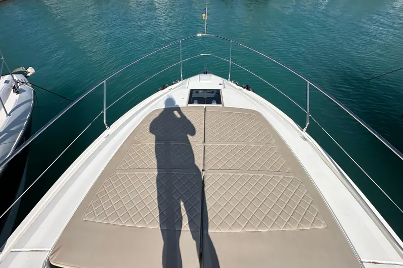  Yacht Photos Pics Shadow on Fairline Targa 45 Open yacht deck, 2020 model, with calm water background.