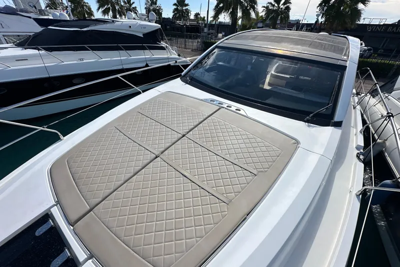  Yacht Photos Pics 2020 Fairline Targa 45 Open yacht with sunpad, docked near palm trees.