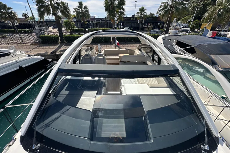  Yacht Photos Pics 2020 Fairline Targa 45 Open yacht with open deck, docked near palm trees.