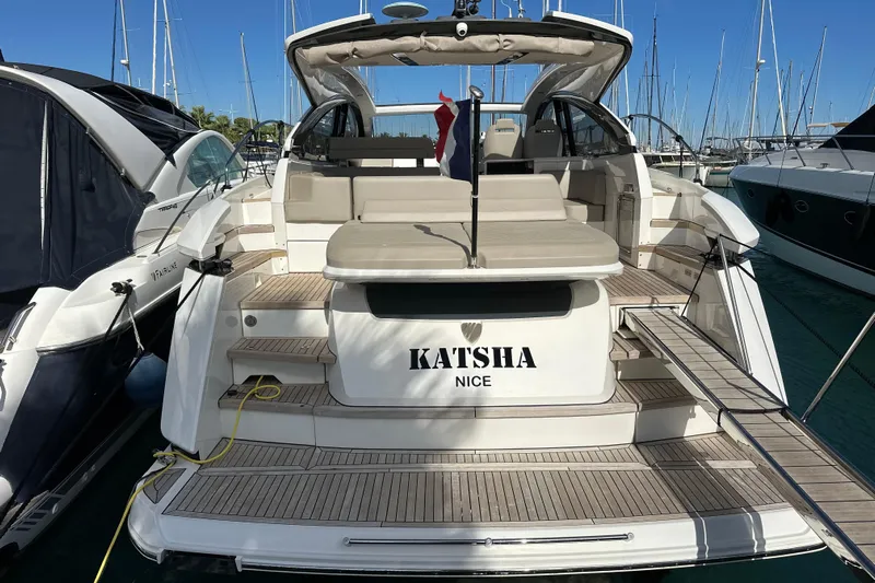  Yacht Photos Pics 2020 Fairline Targa 45 Open yacht docked at marina, rear view.