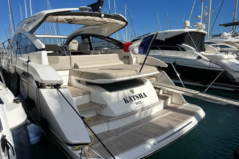  Yacht Photos Pics 2020 Fairline Targa 45 Open yacht docked in marina, rear view.