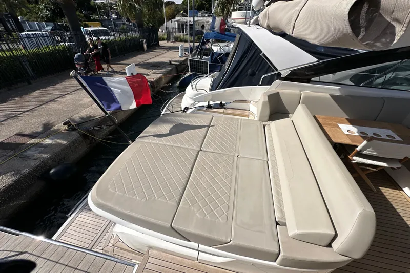  Yacht Photos Pics 2020 Fairline Targa 45 Open yacht with sunbed and French flag at dockside.