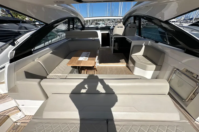  Yacht Photos Pics 2020 Fairline Targa 45 Open yacht interior with luxurious seating and wooden table.