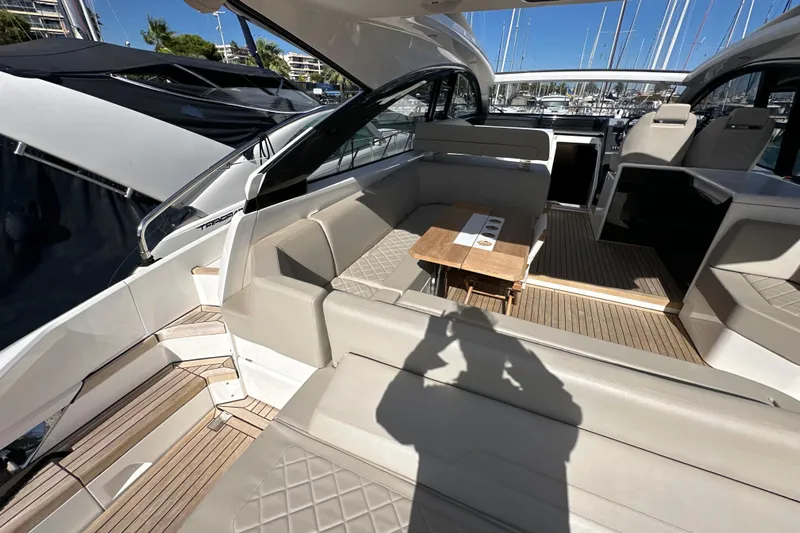  Yacht Photos Pics 2020 Fairline Targa 45 Open yacht interior with luxurious seating and wooden table.