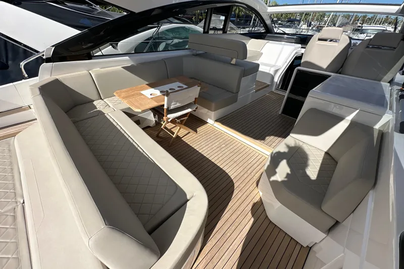  Yacht Photos Pics 2020 Fairline Targa 45 Open yacht interior with luxurious seating and wooden flooring.