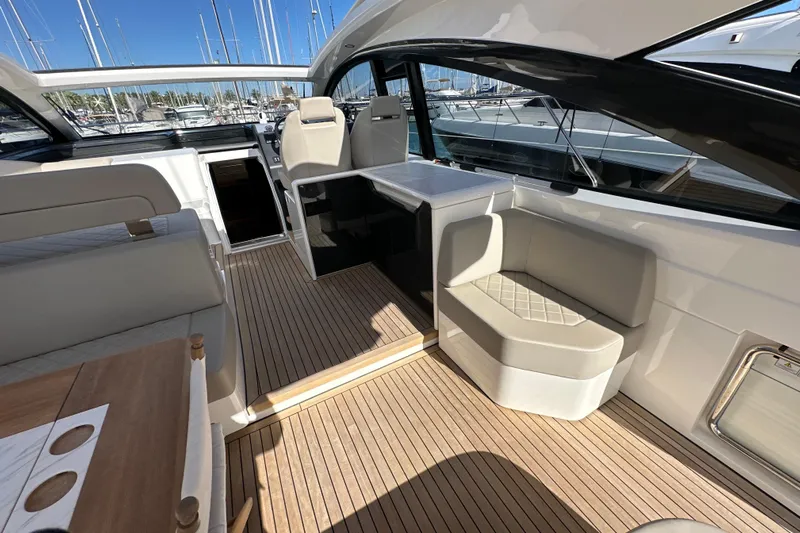  Yacht Photos Pics Luxurious interior of 2020 Fairline Targa 45 Open yacht with elegant seating and wood flooring.
