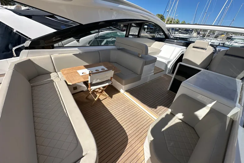  Yacht Photos Pics Luxurious 2020 Fairline Targa 45 Open yacht interior with elegant seating and wooden flooring.