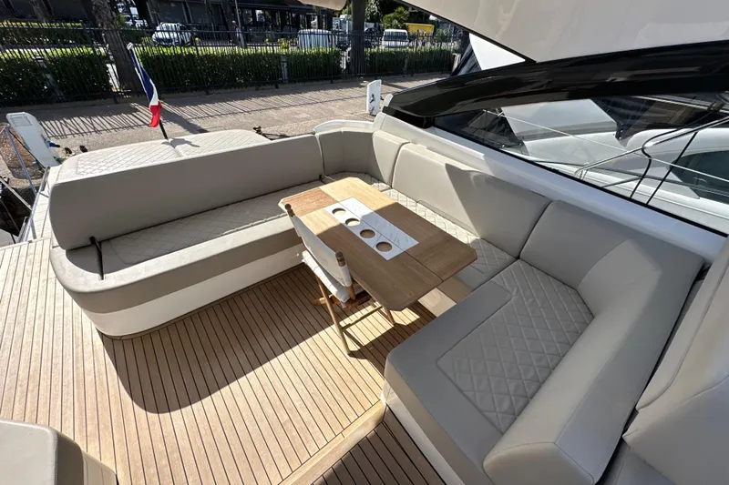  Yacht Photos Pics Luxurious seating area on 2020 Fairline Targa 45 Open yacht with elegant wood table.