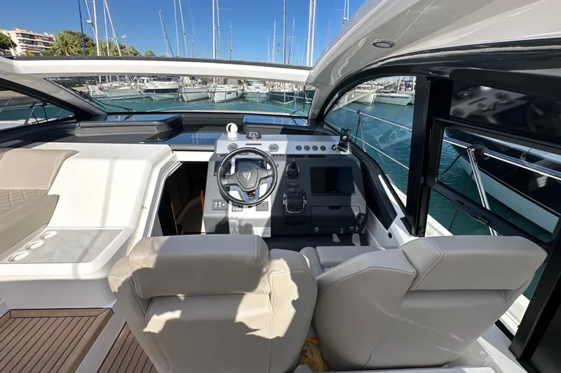 Yacht Photos Pics 2020 Fairline Targa 45 Open yacht cockpit with modern steering and luxurious seating.