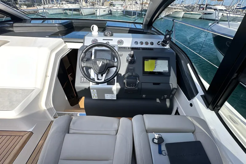  Yacht Photos Pics Cockpit of 2020 Fairline Targa 45 Open yacht with steering wheel and navigation system.