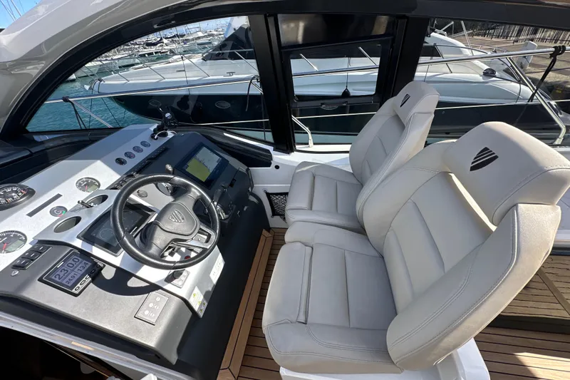  Yacht Photos Pics Cockpit of 2020 Fairline Targa 45 Open yacht with modern controls and seating.