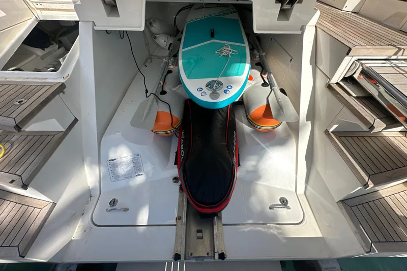  Yacht Photos Pics 2020 Fairline Targa 45 Open yacht with paddleboard and equipment storage.