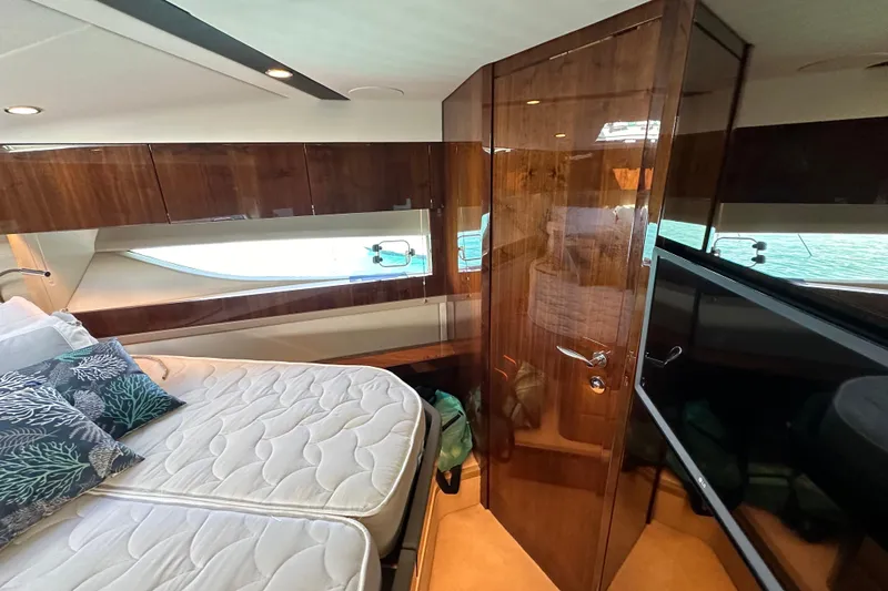  Yacht Photos Pics Luxurious cabin interior of 2020 Fairline Targa 45 Open yacht with elegant wood finishes.