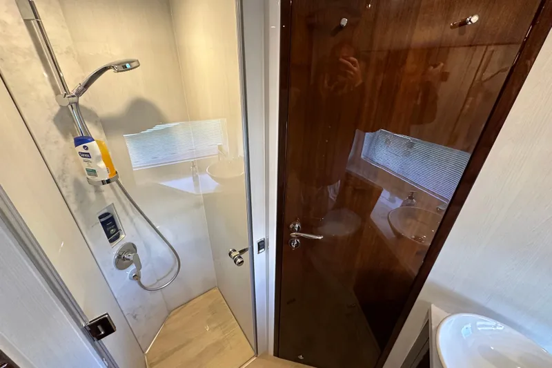  Yacht Photos Pics 2020 Fairline Targa 45 Open yacht bathroom with modern shower and wooden door.